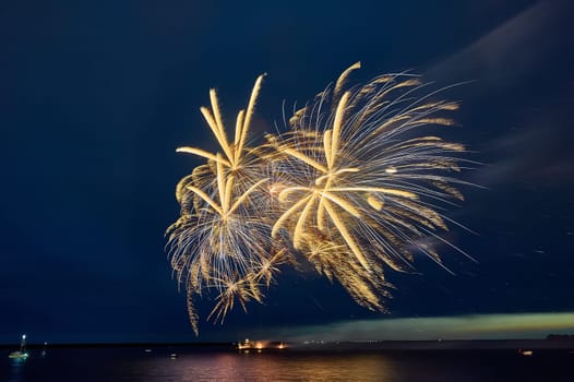 Colorful fireworks on the black sky background. High quality photo