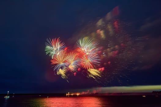 Colorful fireworks on the black sky background. High quality photo