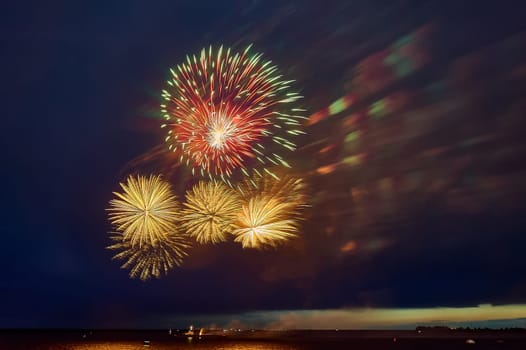 Colorful fireworks on the black sky background. High quality photo