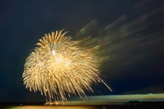 Colorful fireworks on the black sky background. High quality photo