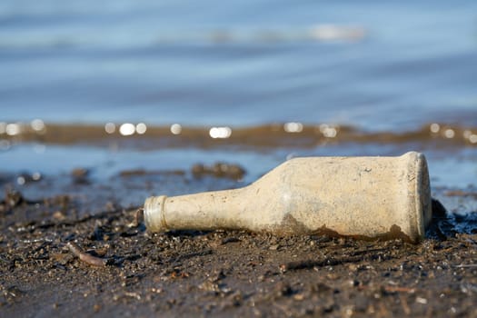 Bottle made of glass on the banks of the Elbe in Herrenkrug Park near Magdeburg