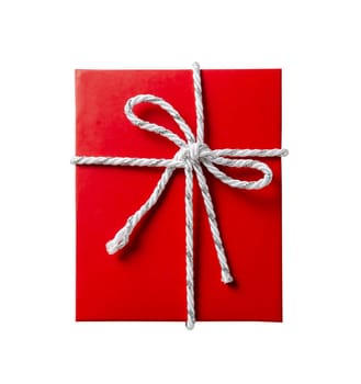 Red gift box with white and silver cord rope ribbon isolated on white background, top view.