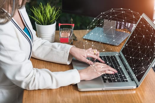 Young business woman work with laptop digital global network on desk at home office