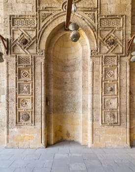 Engraved decorated stone wall with embedded niche in Mamluk era historical public mosque of Sultan al Muayyad, Cairo, Egypt