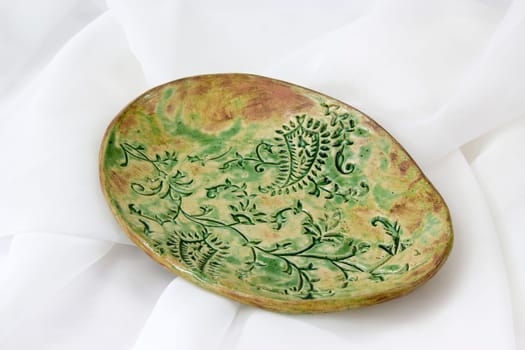 clay plate on white background - handmade pottery