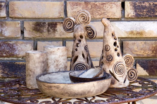 clay pots on a metal table -  handmade pottery