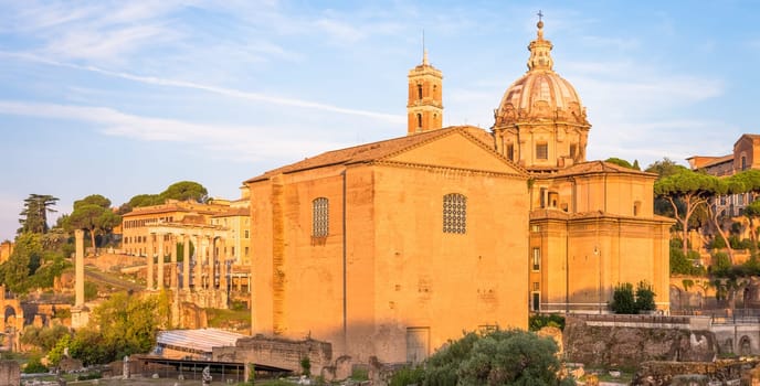 ROME, ITALY - CIRCA AUGUST 2020: sunrise light with blue sky on Roman ancient architecture.