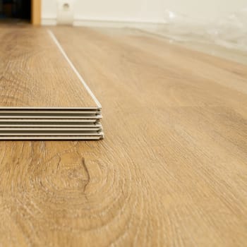 Click vinyl flooring to install yourself in the living room of an apartment