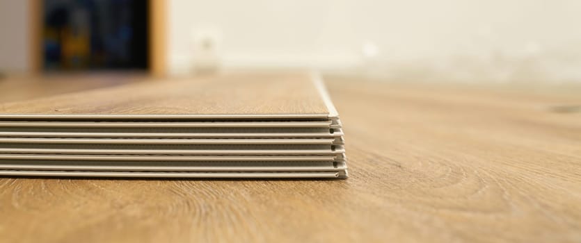 Click vinyl flooring to install yourself in the living room of an apartment