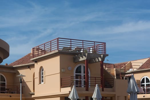 View of holiday apartment complex with swimming pool in Meloneras, Gran Canaria in Spain.
