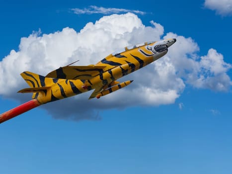 Fighter jet flying against a blue sky