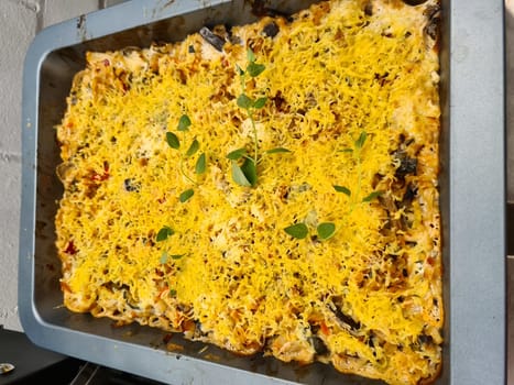 Fresh made Pasta Bake on an old wooden table (close-up shot)