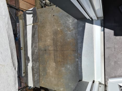 Montage of handyman laying a tiled floor