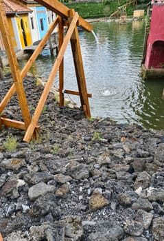 Wooden rainwater inlet into a lake