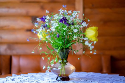 Still Life: a delicate bouquet of wildflowers in a vase