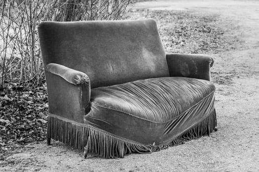 Sofa is taken out of service because of damaged disused seat surface. Old design furniture broken from overweight encounters meetings.