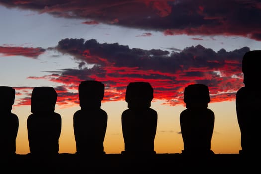 Dramatic colorful sunrise over Moai stone sculptures at Ahu Tongariki, Easter island, Chile