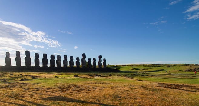 Sunrise over Moai stone sculptures at Ahu Tongariki, Easter island, Chile