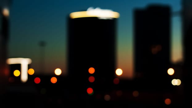mysterious colored lights of the night city. blurry focus