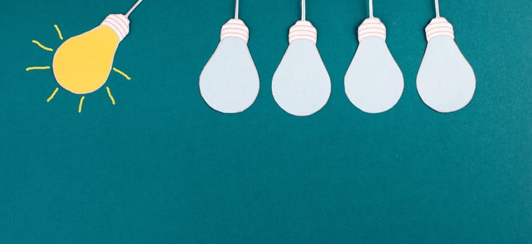 Standing out from the crowd, having a new idea, light bulb concept, be different, leadership