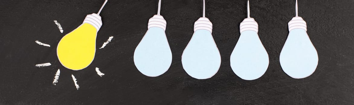 Standing out from the crowd, having a new idea, light bulb concept, be different, leadership