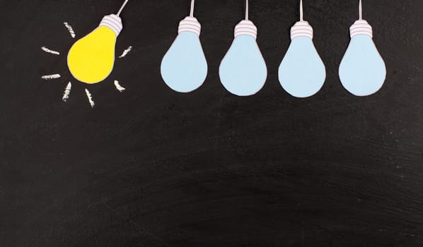 Standing out from the crowd, having a new idea, light bulb concept, be different, leadership