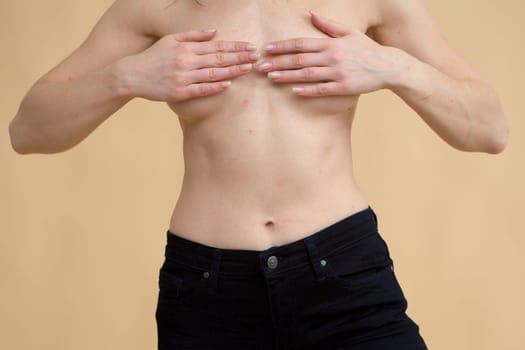 Close up of fit woman torso with sweat on skin after workout