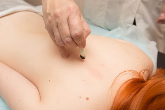 Tired worried man enjoying therapeutic massage
