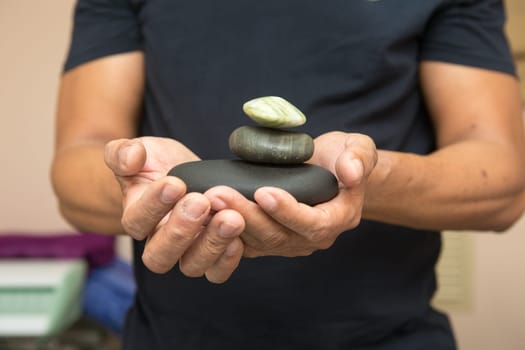 stones for stone therapy in the hands.
