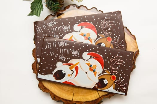 Milk and dark chocolate with a Christmas theme .