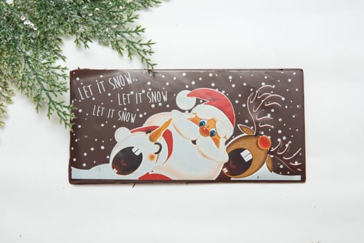 Milk and dark chocolate with a Christmas theme .