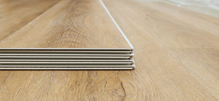 Click vinyl flooring to install yourself in the living room of an apartment