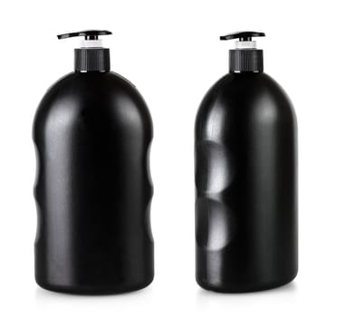 The Black cosmetic bottle with pump isolated on white background. Mockup of container for soap, shampoo, shower gel
