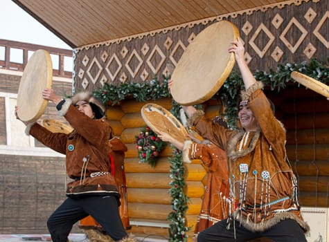 PETROPAVLOVSK, KAMCHATKA, RUSSIA - DECEMBER 24, 2021: Folk ensemble performance in dress of indigenous people of Kamchatka. The holiday Northern aboriginal Koryak