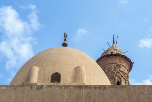 Dome at public historic mosque of Sultan Al Nassir Qalawun revealing minaret of Mamluk era El Zaher Barquq Mosque, Moez Street, Cairo, Egypt