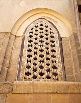 Perforated stucco window decorated with geometrical patterns, located at Mamluk era public historical Qalawun complex, Moez Street, Cairo, Egypt