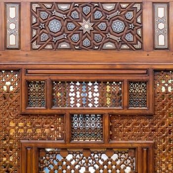 Arabesque ornaments of an old aged decorated wooden wall, Old Cairo, Egypt