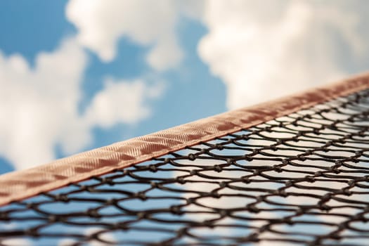 a tennis net against the blue sky
