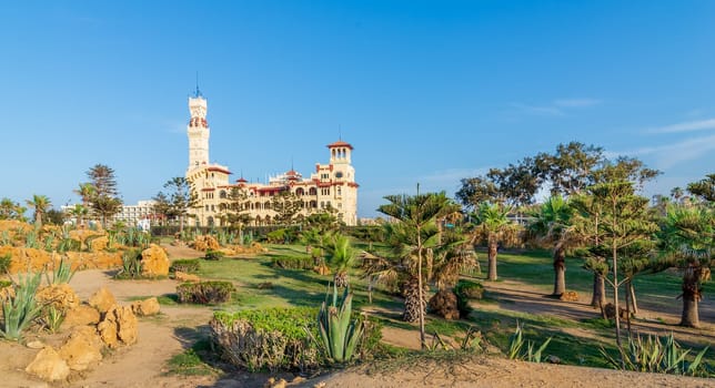 Day shot of Montaza public park with Royal palace and Palestine Hotel at far end, Alexandria, Egypt