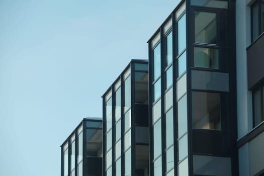 glass building against a blue sky low angle of view, minimalism in architecture