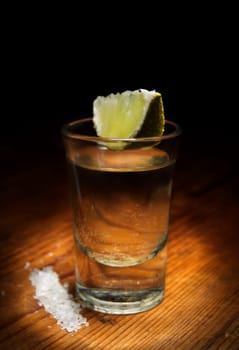 Tequila shot with lime slice and salt