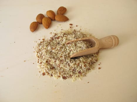 Almond flour, ground almonds on a wooden board