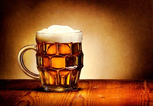 Beer mug on rustic wooden table