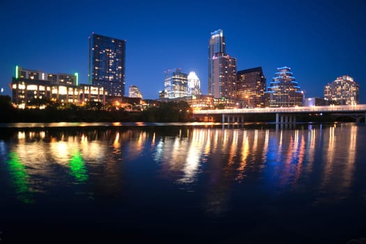 As the sky darkens the city lights brighten and get reflected in the Colorado River
