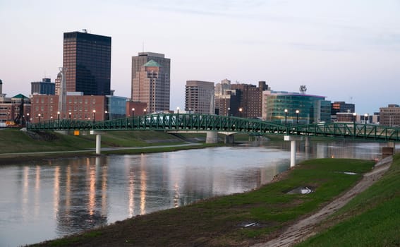 Sunrise comes to the Miami River flowing through Dayton Ohio