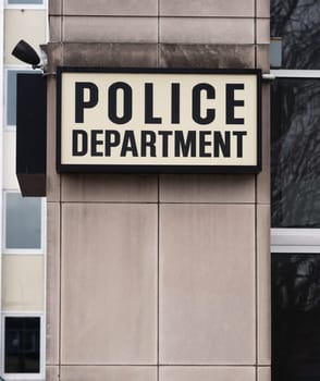 Vertical composition of Police Department sign outside