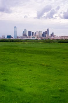 A storm brews over the buildings of downtown Dallas Texas