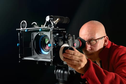 man with a professional movie camera