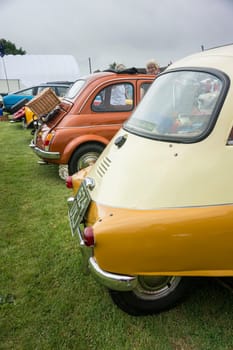 APPLEDORE, KENT, UK, 20TH JULY 2014 - Rear view of a BMW Isetta and other classic cars