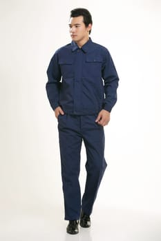 The young engineer various occupation clothing standing in front of a white background